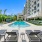 swimming pool surrounded by lounge chairs