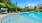swimming pool surrounded by lounge chairs