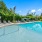 swimming pool surrounded by lounge chairs
