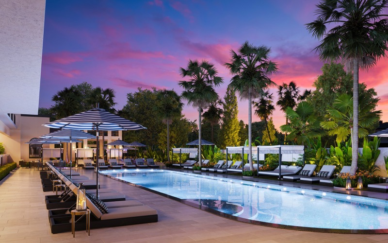Arvella's community outdoor pool lit up at night